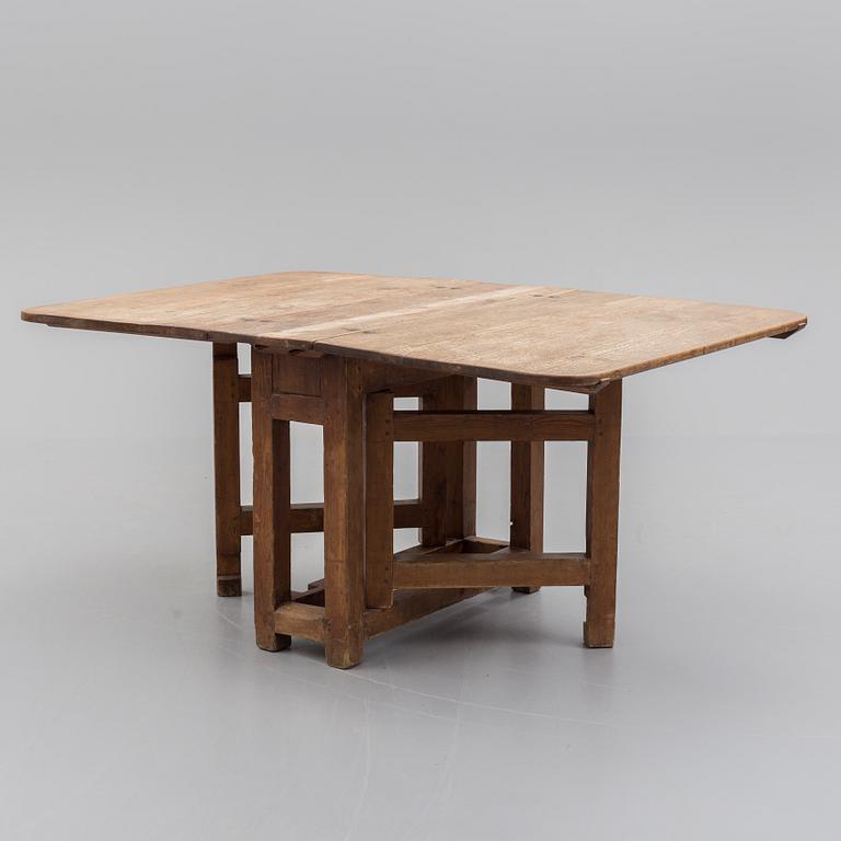An 18th century gate leg table.