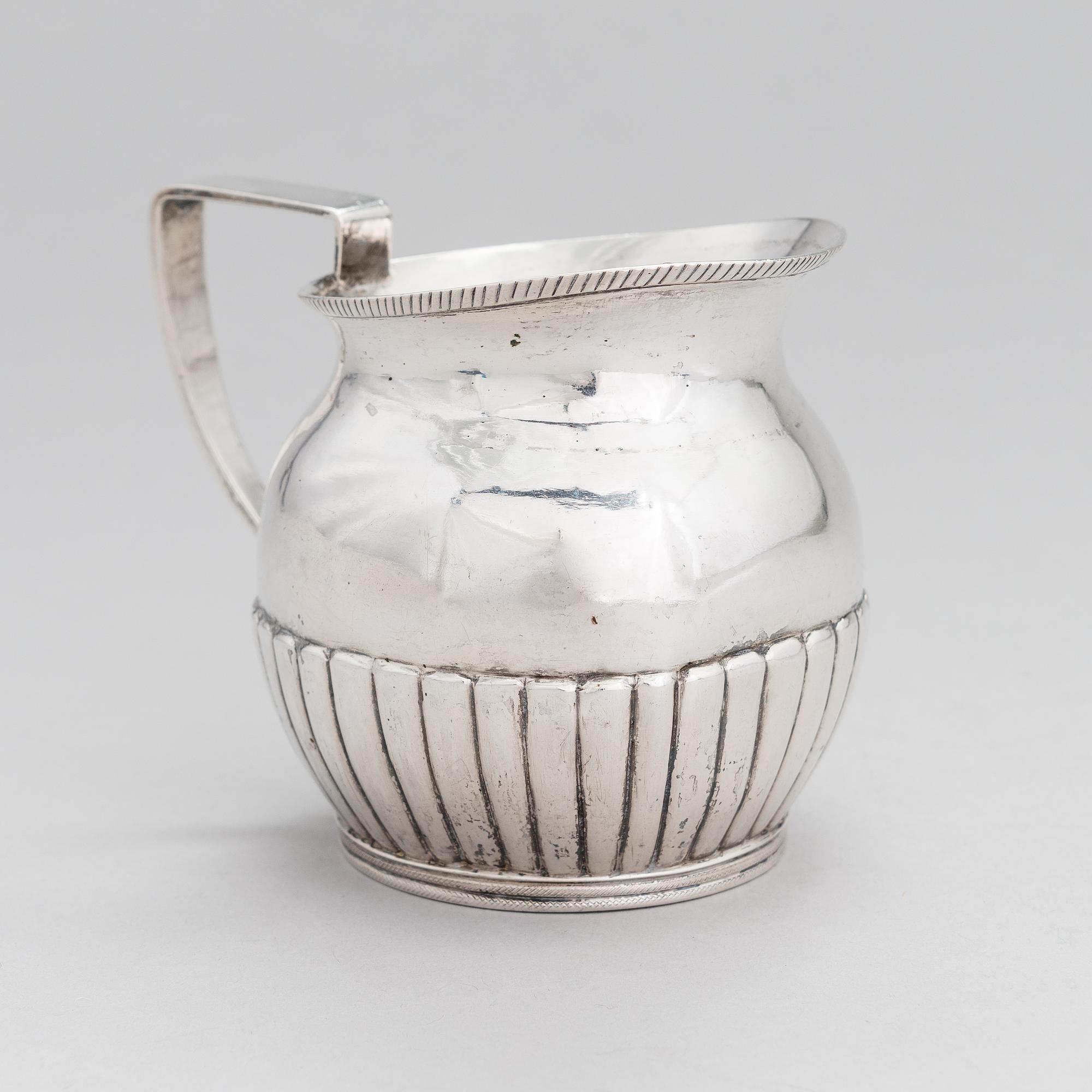 A silver, cream jug, Cyrillic maker's mark Sinkoni, Finland 1824.