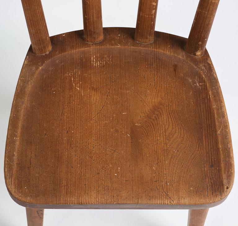 Axel Einar Hjorth, a set of four stained pine "Utö" chairs, Nordiska Kompaniet, Sweden 1930s.