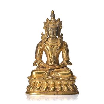 1025. A gilt bronze sculpture of Amitayus, 20th century.