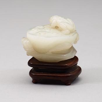 A pale celadon nephrite carving of a lotus pod, Qing dynasty (1644-1912).