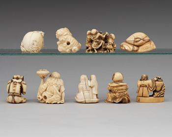 A set of nine Japanese bone and ivory netsukes, Meiji period, circa 1900.