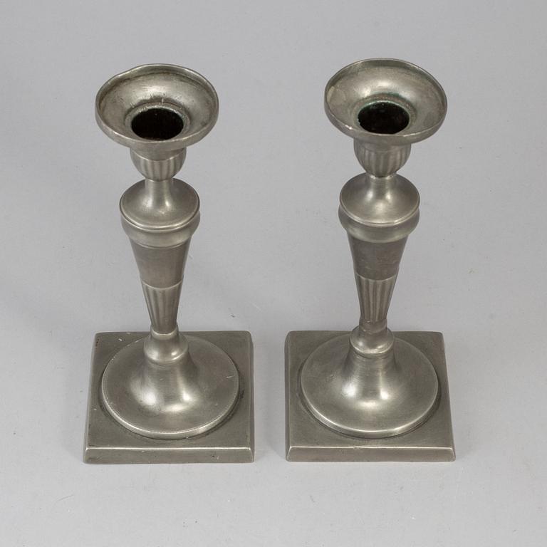 A pair of 18th century pewter candlesticks.