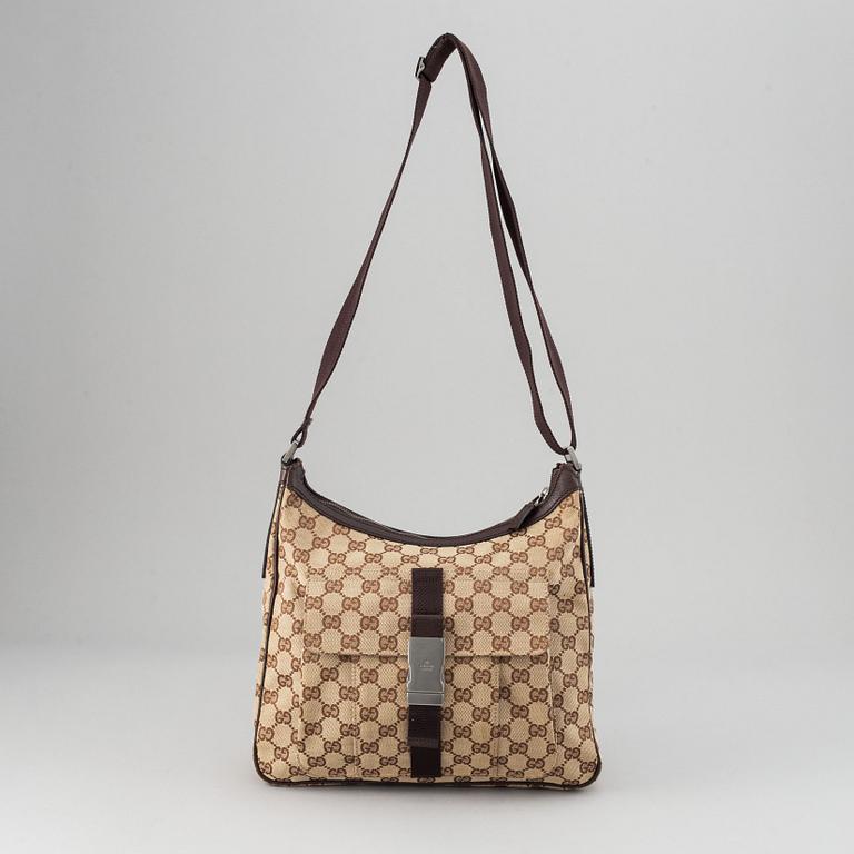 Gucci, a monogram canvas messenger bag.