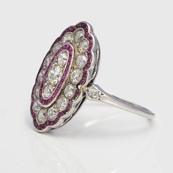 A ca 0.95 cts old-cut diamond ring with faceted rubies.