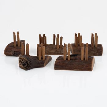 Magnus Ek, a set of five oak wood snack holders for Oaxen Krog, 2021.