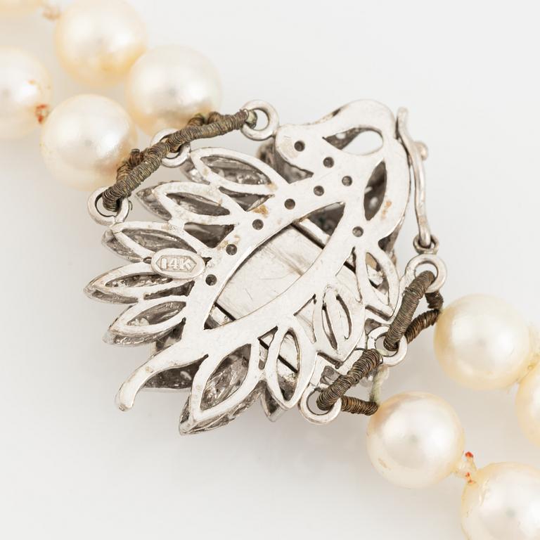 Two strand cultured pearl necklace, clasp with diamonds.