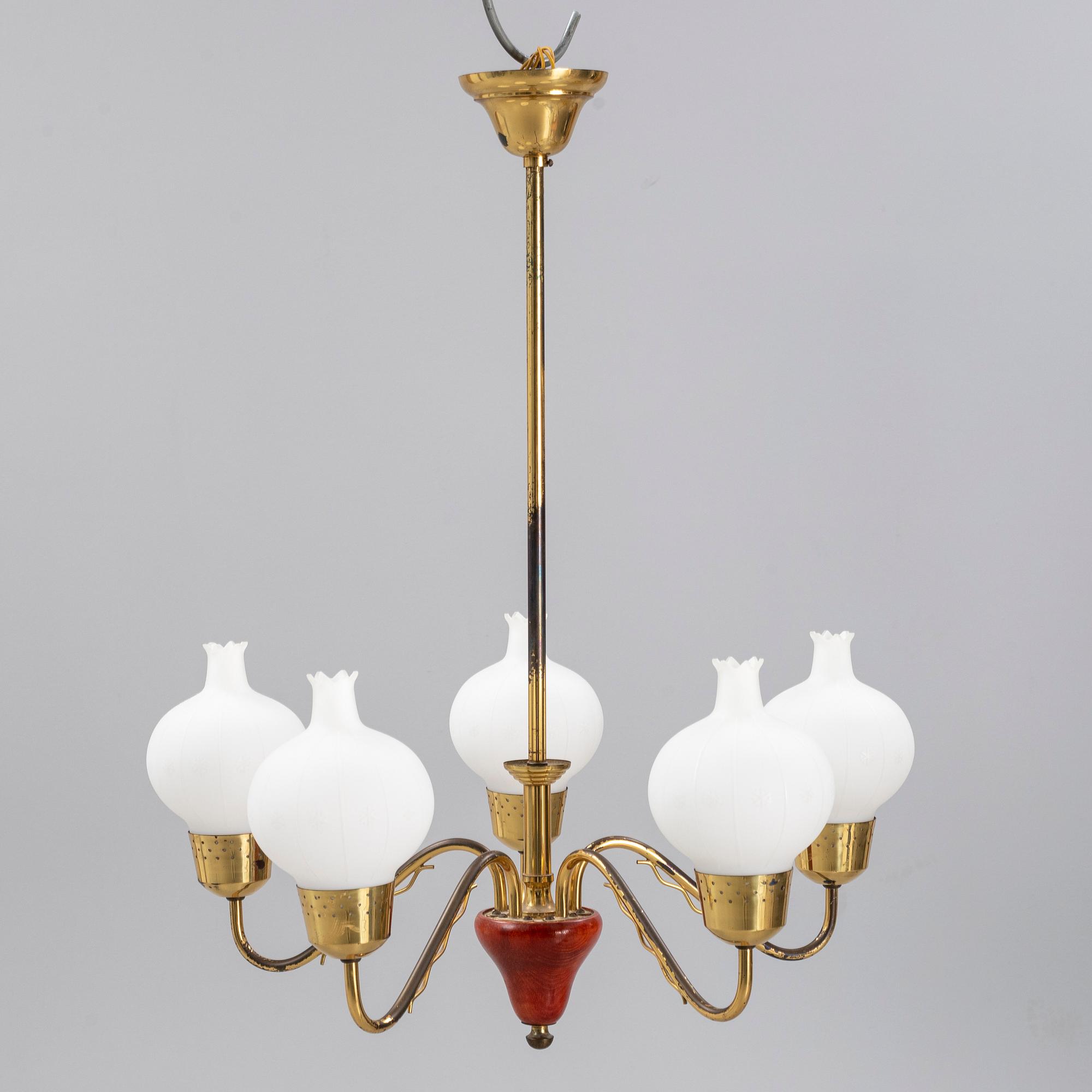 A 1950's glass and brass ceiling light.