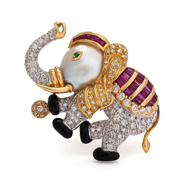 An 18K gold/ white gold elephant brooch with brilliant-cut diamonds, rubies, emerald, and cultured baroque pearl.