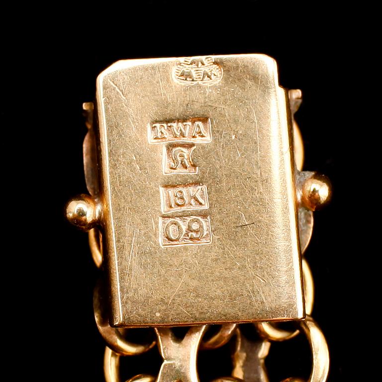 ARMBAND, 18 k guld, EWA 1964. Vikt 15 g.