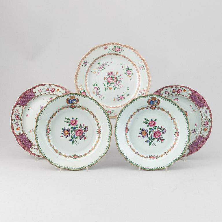 A pair of armorial dinner plates and a group of three odd famille rose plates, Qing dynasty, Qianlong (1736-95).