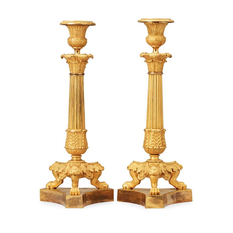 A pair of late Empire 19th century gilt bronze candlesticks.