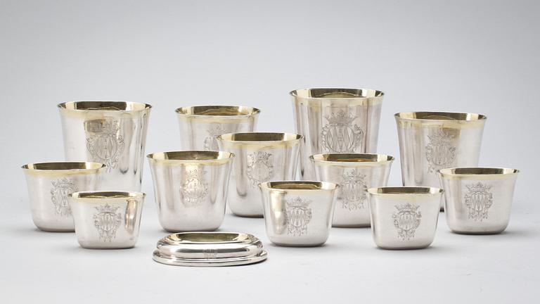 A set of 12 Swedish early 18th century parcel-gilt hunting-beakers and cover, marks of Petter Henning, Stockholm 1707.