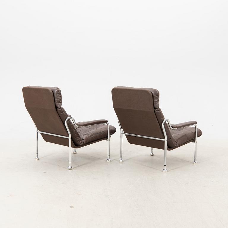 A pair of "Stålbo" easy chairs by Bo Eigert for B. Eigert AB Hova Sweden 1970:s.