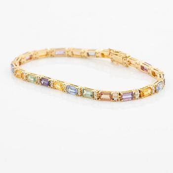 Bracelet 18K gold with multi-coloured sapphires and round brilliant-cut diamonds.