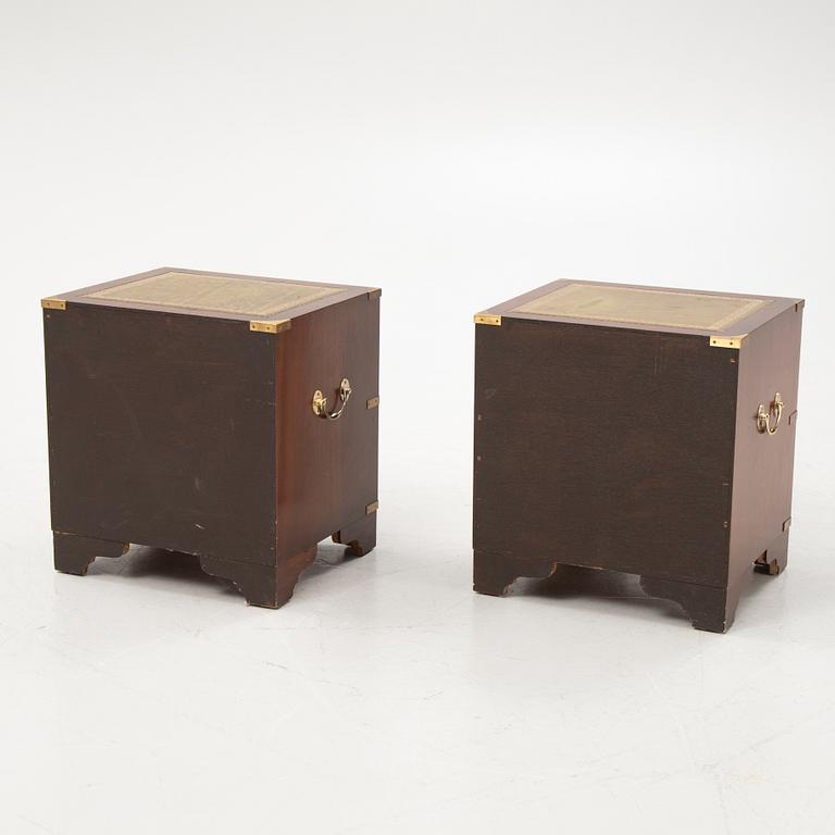 A pair of english style bedside tables from the second half of the 20th century.