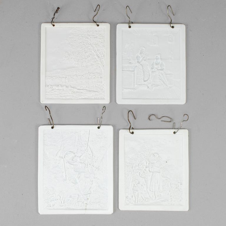 Four transparant lithophane plaques, 19th century.