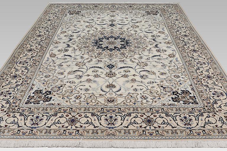 A Nain carpet, part silk, so-called 9 LAA, approx. 355 x 248 cm.