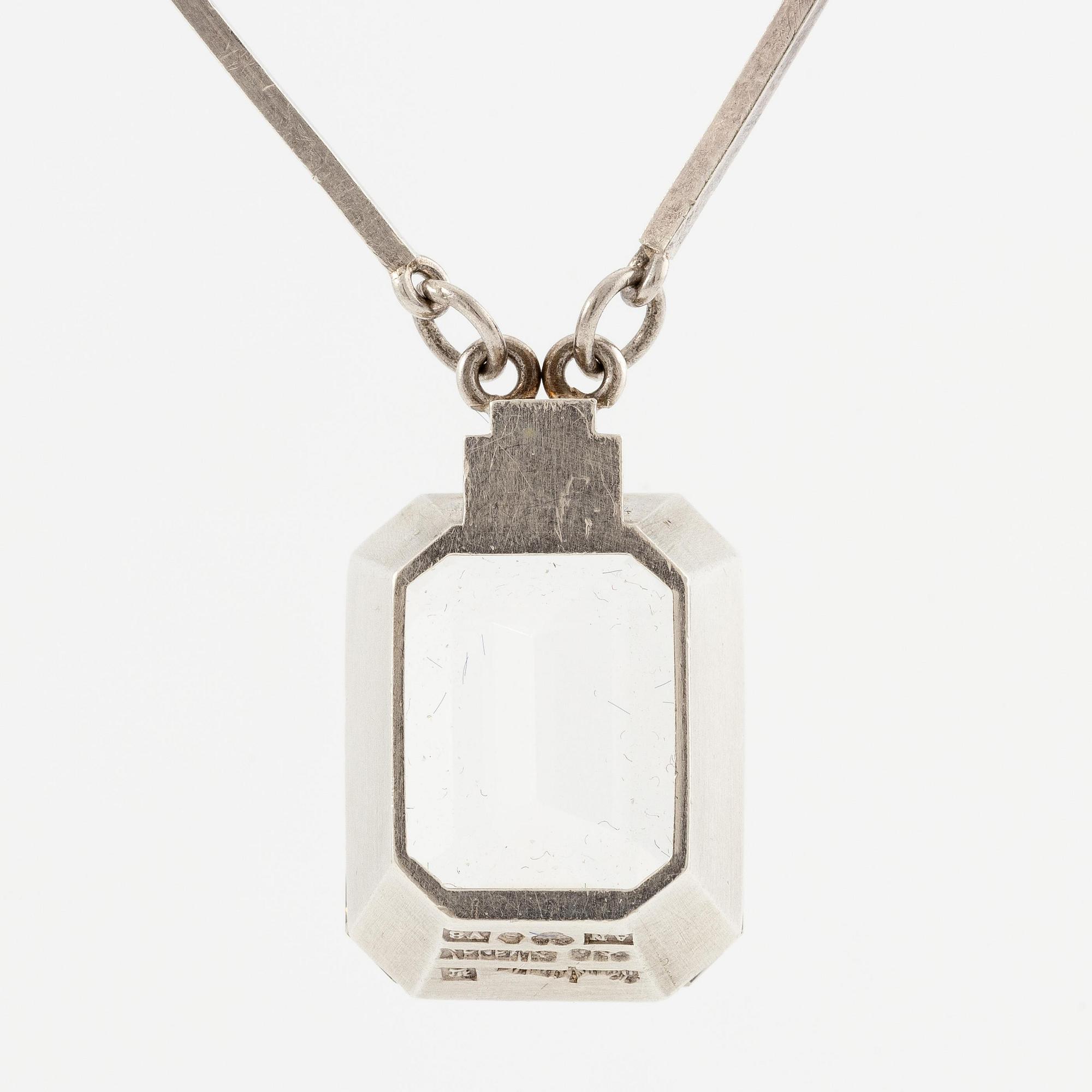 Wiwen Nilsson, a necklace, ring and pendant chain with pendant, silver with rock crystal, Lund 1947.