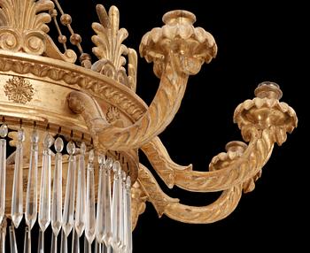 A German Empire 19th century ten-light gilt wood hanging lamp, possibly after K. F. Schinkel.