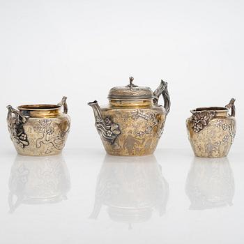 A 9-piece parcel-gilt sterling silver tea set, maker's mark of Samuel Smily, Goldsmiths Alliance Ltd, London 1873-74.