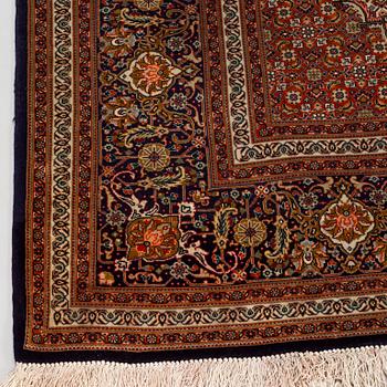 A Tabriz part silk carpet, Mahi, c. 297 x 200 cm.