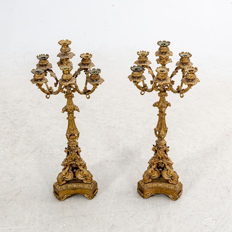 A pair of late 19th century metal candelabras.