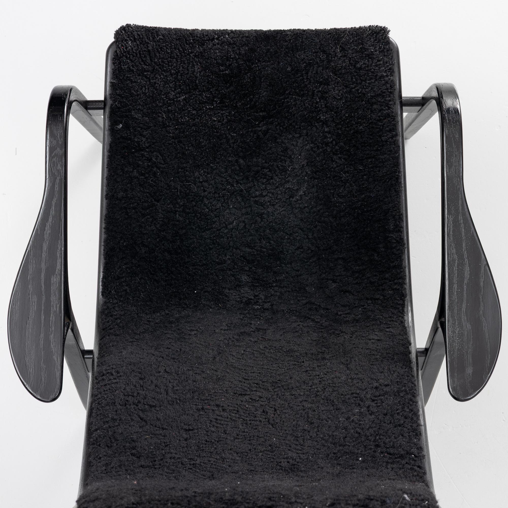 Yngve Ekström, a 'Lamino' easy chair with foot stool, Swedese 2010.