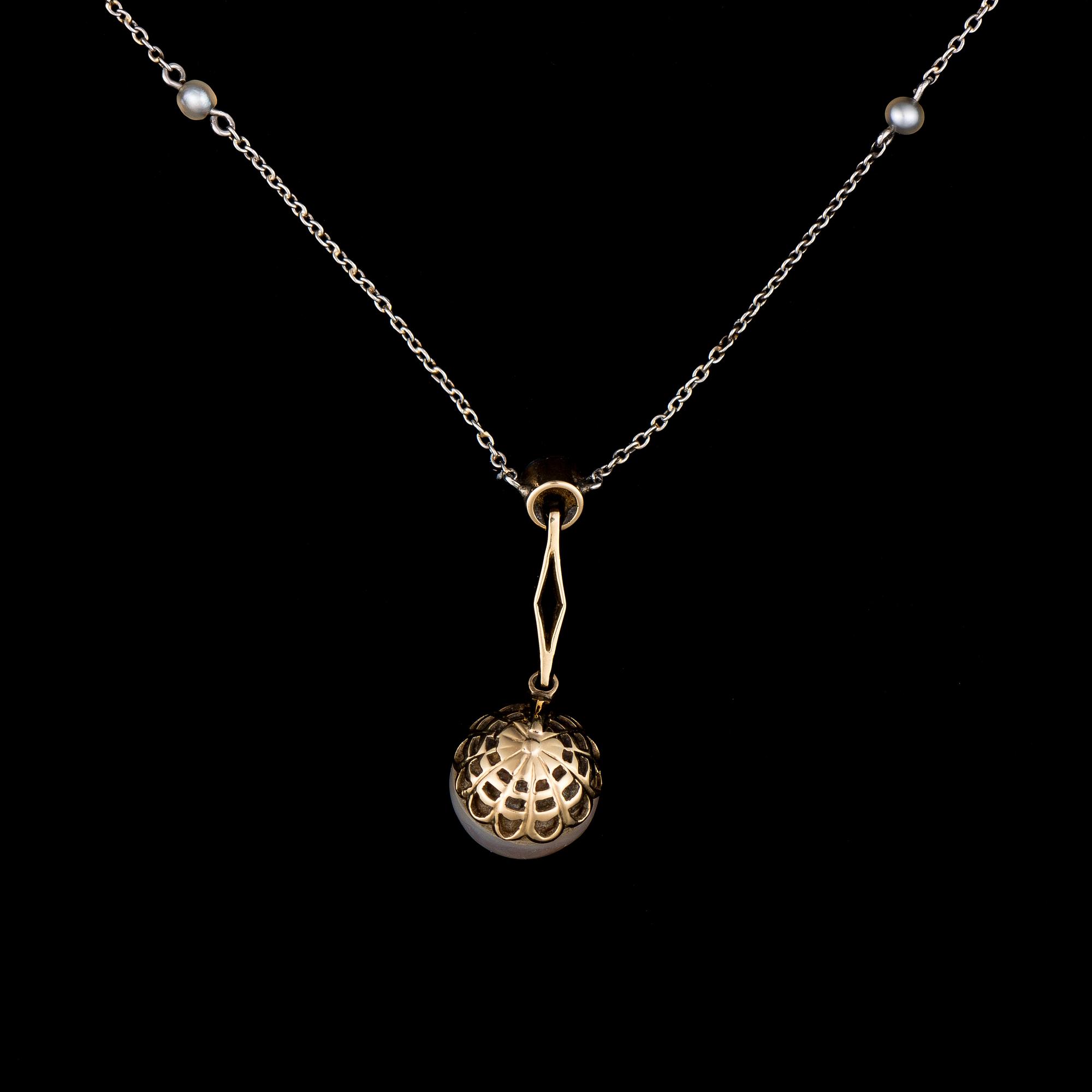 A PENDANT, platinum, diamond, pearl. Russian maker's marks, St Petersburg early 1900s.