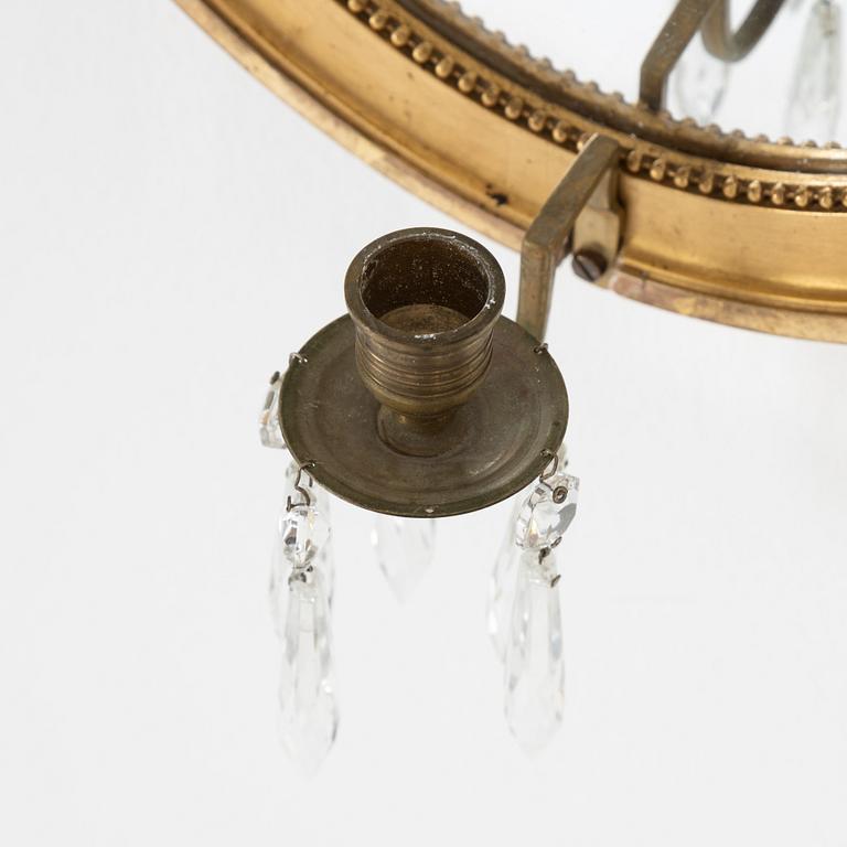 A pair of gilt Gustavian style mirror wall sconces, 20th Century.