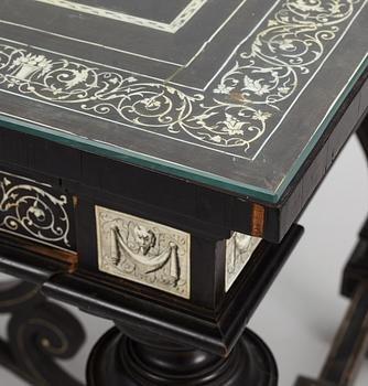 A Renaissance-style ebony, ebonized and ivory-inlaid library table, late 19th century, presumably Germany.