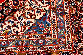 A Keshan rug, signed, 410 x 295 cm.