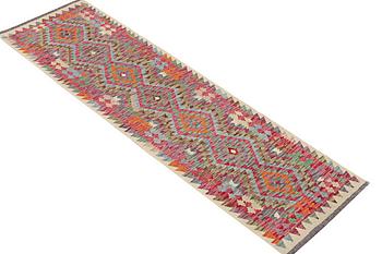 A runner carpet, Kilim, c. 294 x 81 cm.