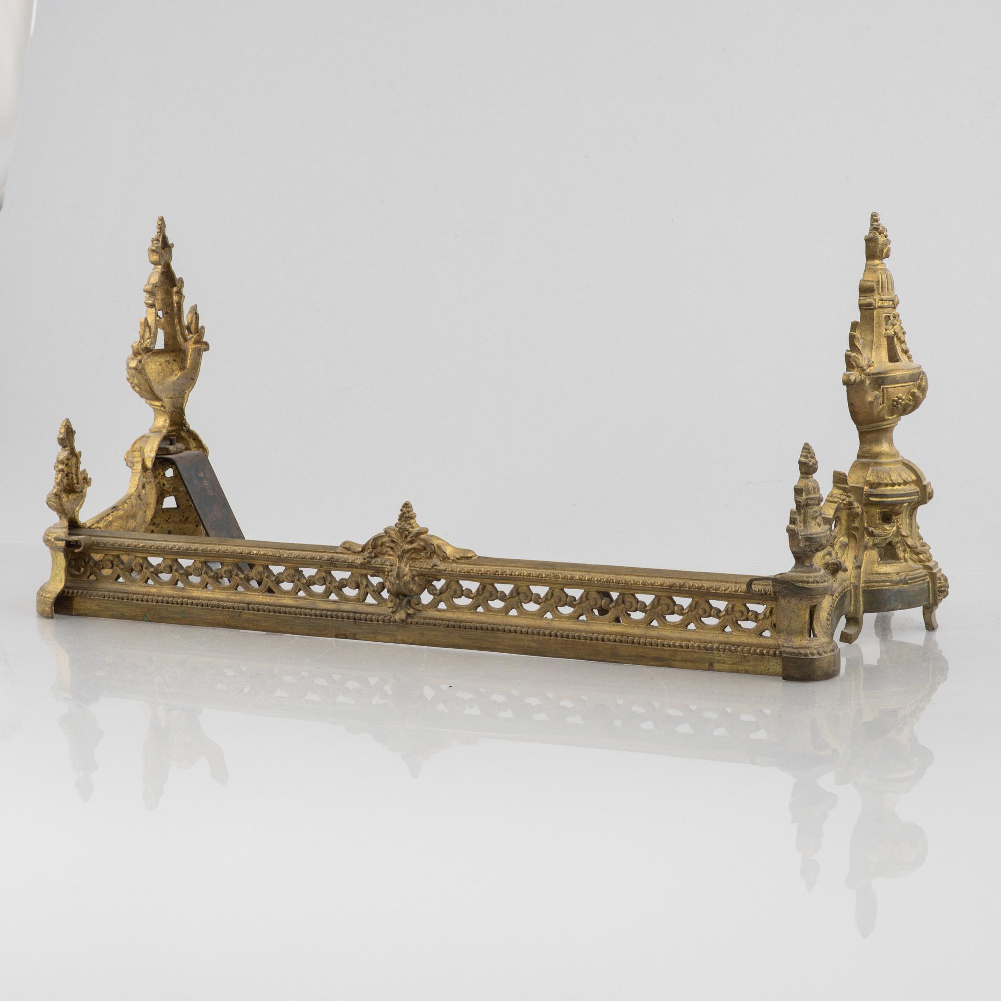A pair of Louis XVI-style bronze andirons, France, later part of the 19th century.