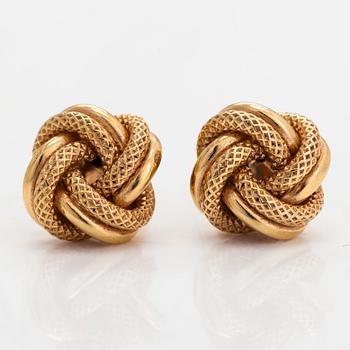 A pair of 14K gold earrings in form of knots.