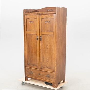 An early 1900s oak cabinet.