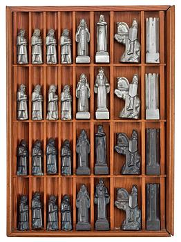 576. A Tore Strindberg pewter chess set, Herman Bergman, Stockholm, in its wooden box.