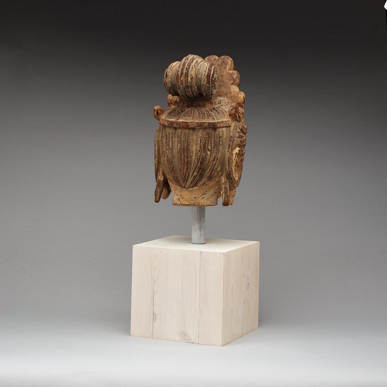 A wooden scultpure of the head of Guanyin, Ming style.