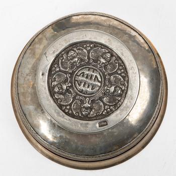 Two Tibetan bowls, low-grade silver and burl-wood, Early 20th century.