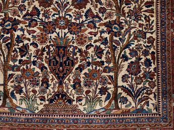A RUG. A semi-antique silk Kashan. 205,5 x 131,5 cm.