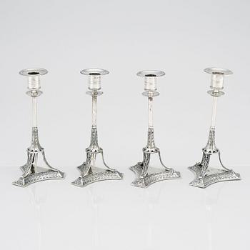 A set of four Swedish early 19th Century silver candlesticks, mark of Adolf Zethelius, Stockholm 1814 and 1818.