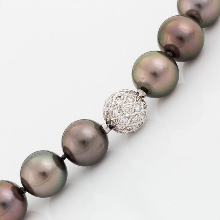 A Tahitian cultured pearl necklace with an 18K white gold clasp set with round brilliant-cut diamonds.