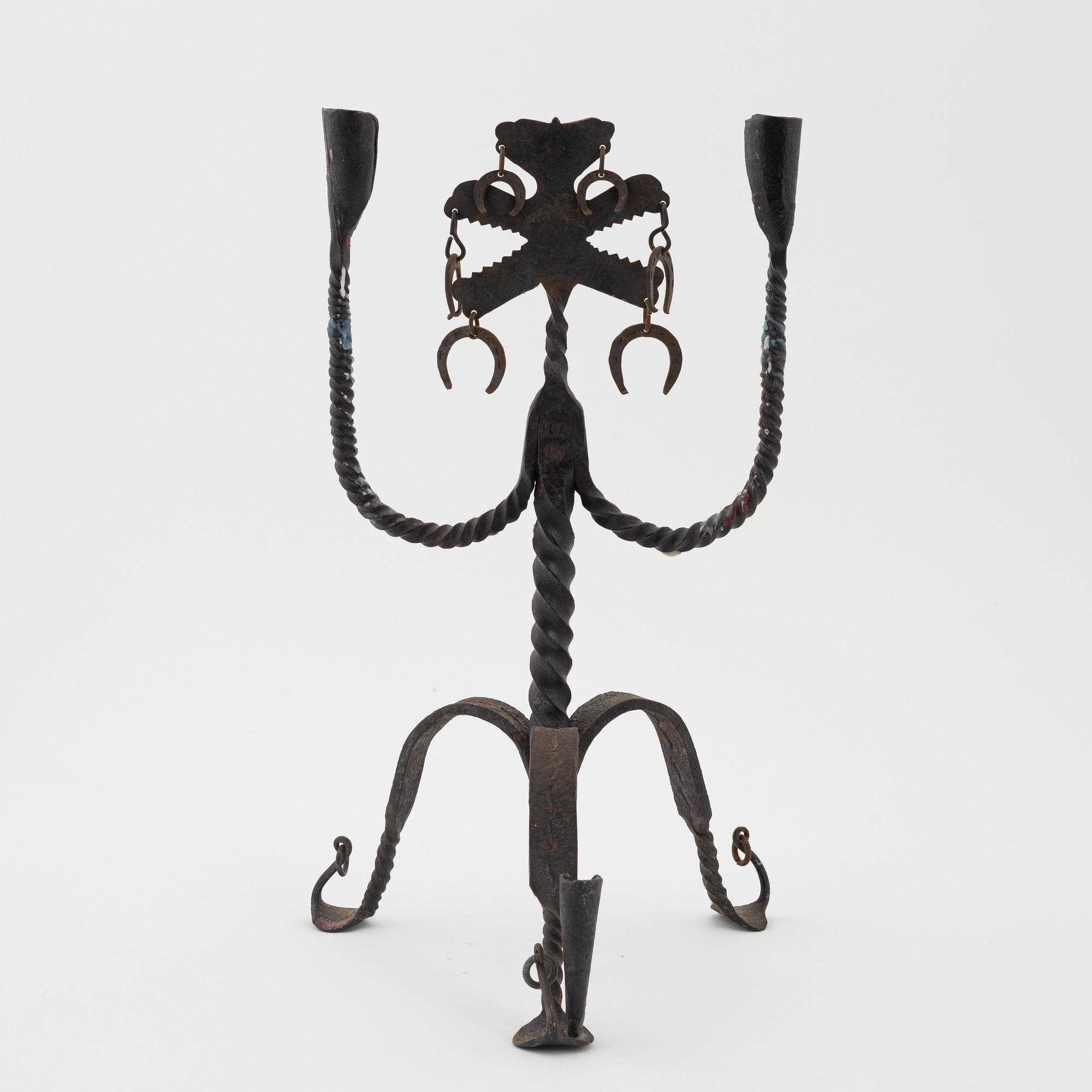 A Seedish wrought-iron three-light candlestick, circa 1900.