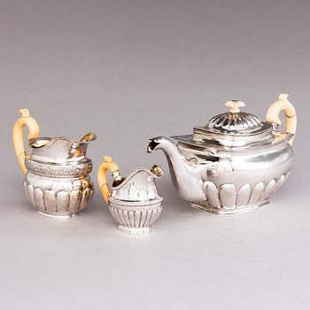 A Russian silver teapot and two silver milk jugs, St Petersburg 1824-1839, jugs marked Georg Randelin and Thomas Sohka.