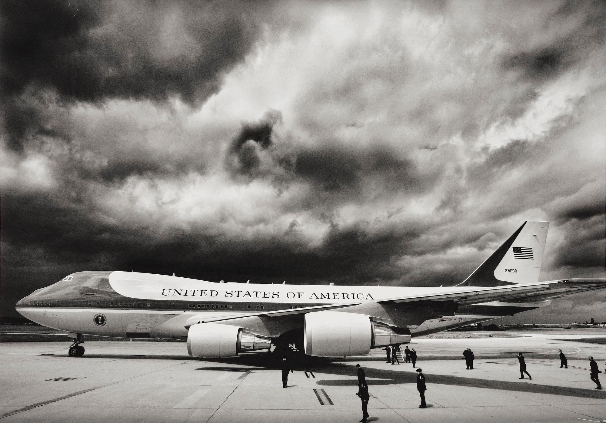 Brooks Kraft, "Storm clouds loom overhead as Air Force One and U.S. President George W. Bush arrive in Paris", 2003.