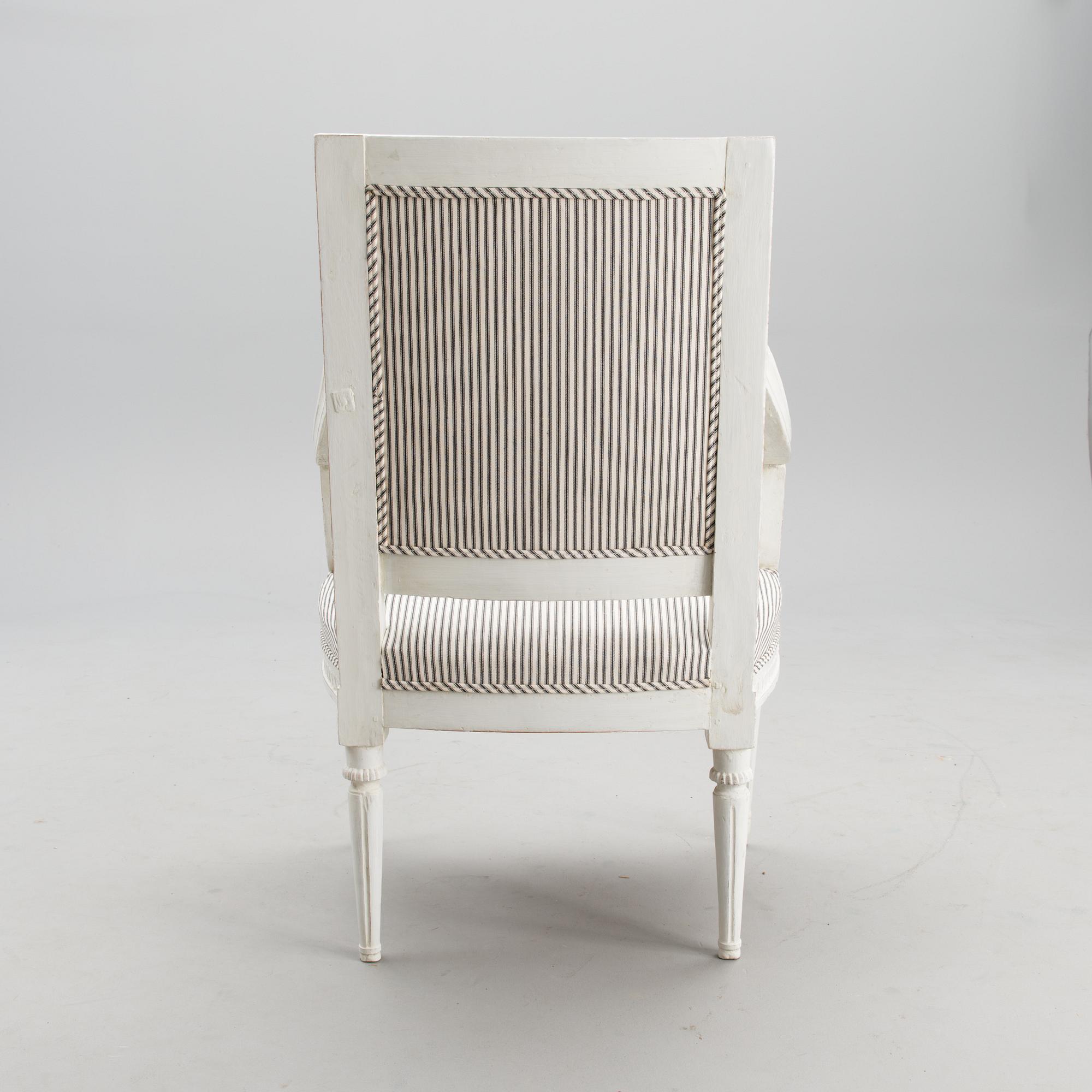 A late 18th century Swedidh Gustavian open arm chair.