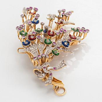 A 17K gold brooch/pendant with rose-cut diamonds, cabochon-cut rubies and enamel.