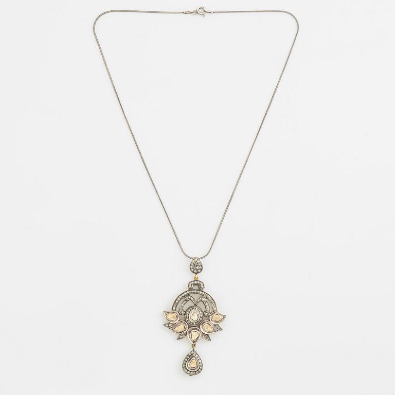 A faceted diamond necklace.