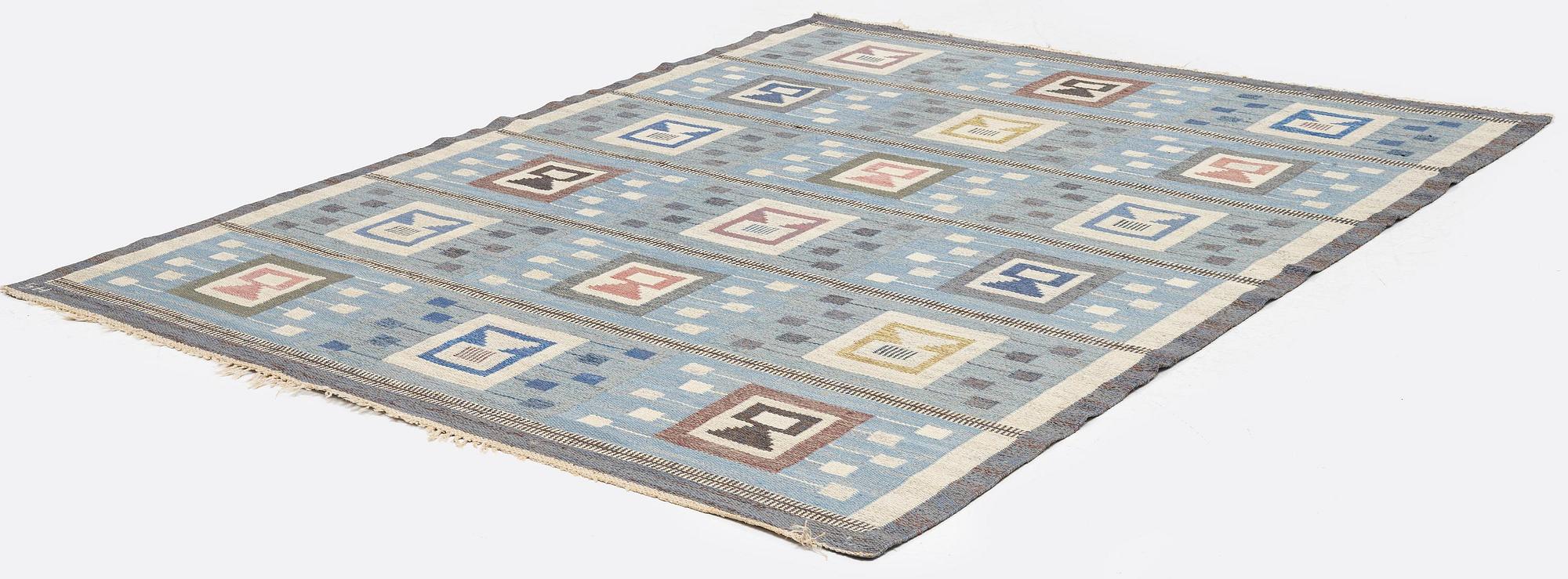 Edna Martin, a carpet, 'Flickorna i fönstret', flat weave, c 251 x 204 cm, signed SH.