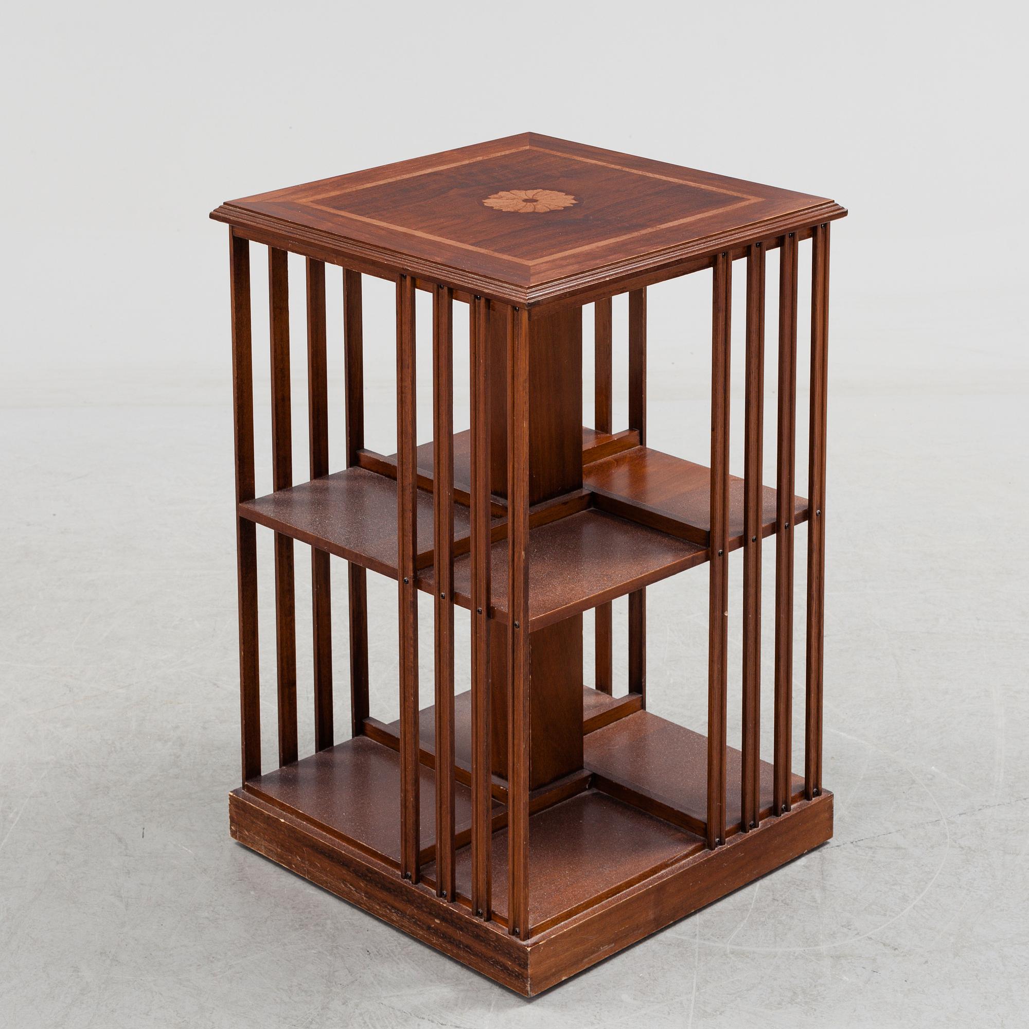 A mahogany veneered revolving bookcase, late 20th Century.
